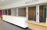 FlexiGlide Classic Chainlink sliding shutter at a reception desk with a high and low section