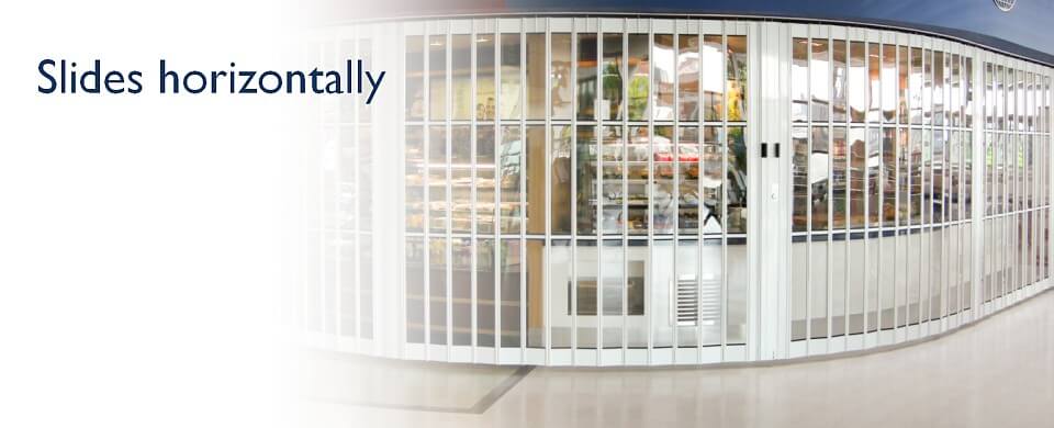A horizontally sliding security shutter; Slides horizontally