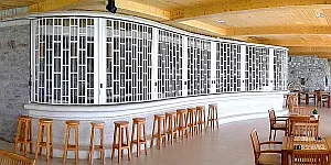 Sliding shutter on beautifully curved bar counter