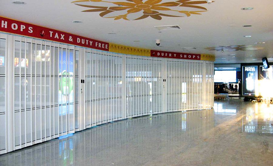 Long run of curved sliding shutters at Alexandria airport