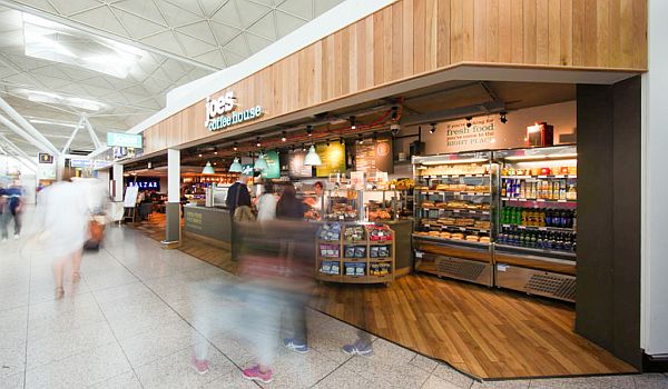 People moving in front of a Joe's Coffee House shop in the terminal building of Gatwick Airport in London