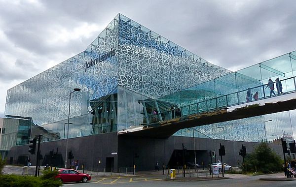 Part of the Highcross Shopping Centre in Leicester with a footbridge crossing Vaughan Way below.