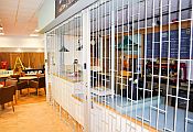 Sliding security shutter in front off coffee servery