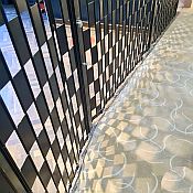 Light falling through a Barrier security shutter creates an interesting pattern on the floor