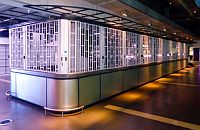 Sliding security shutter closing off a bar island in the O2 Arena. The HVAC system is visible above the shutter.