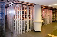 full height curved sliding shutter between a reception desk and a pillar