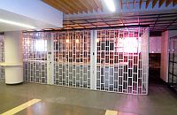 sliding shutter hanging from a ceiling support system