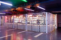 Sliding folding shutter closed in front of a round-shaped bar