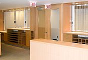 A pair of sliding security shutters at NHS reception desks
