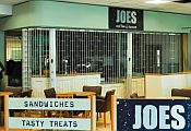 Joes Coffee House cafe with sliding shutter inside the Bournemouth Airport terminal building