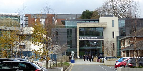 Students walking in front of the University of Exeter Business School building
