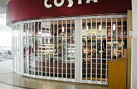 Vision Glass sliding shutter by FlexiGlide closed in front of a food-servery