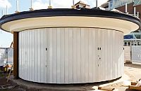 FlexiGlide protector solid sliding shutter going round a kiosk