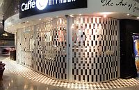 FlexiGlide Barrier Sliding Shutter installed in front of a kiosk
