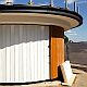 Solid sliding security shutter with a curve