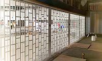 sliding security shutter seen from inside a shop, just after installation