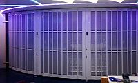curved aluminium sliding shutter under blue light